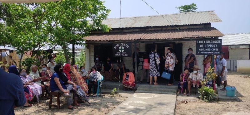People wait COVID-19 vaccination outside a health centre in Dimapur in April. (Morung File Photo by Manen Aier)